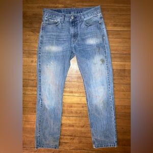 Distressed mud washed Levi’s.